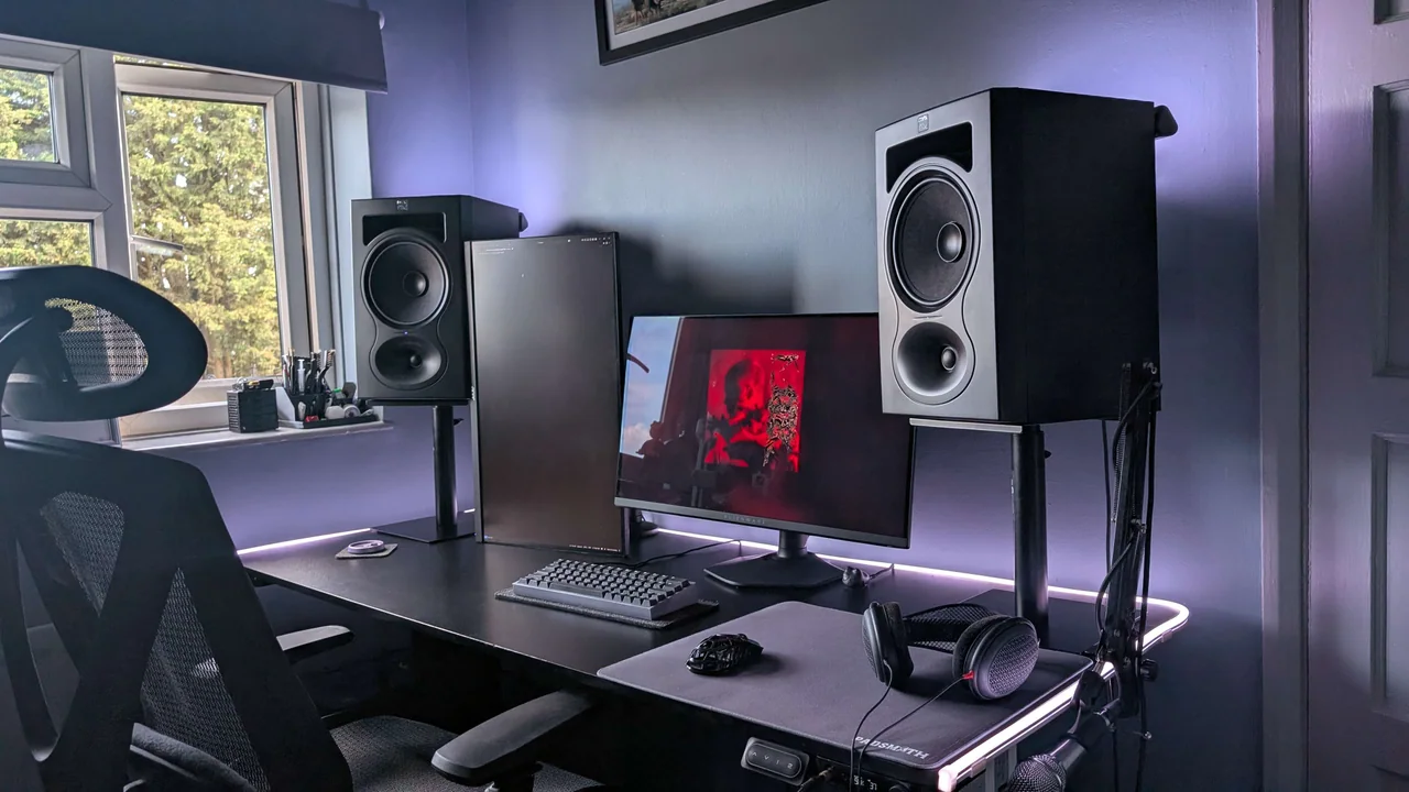 My desk, monitors, speakers, keyboard, and headphones